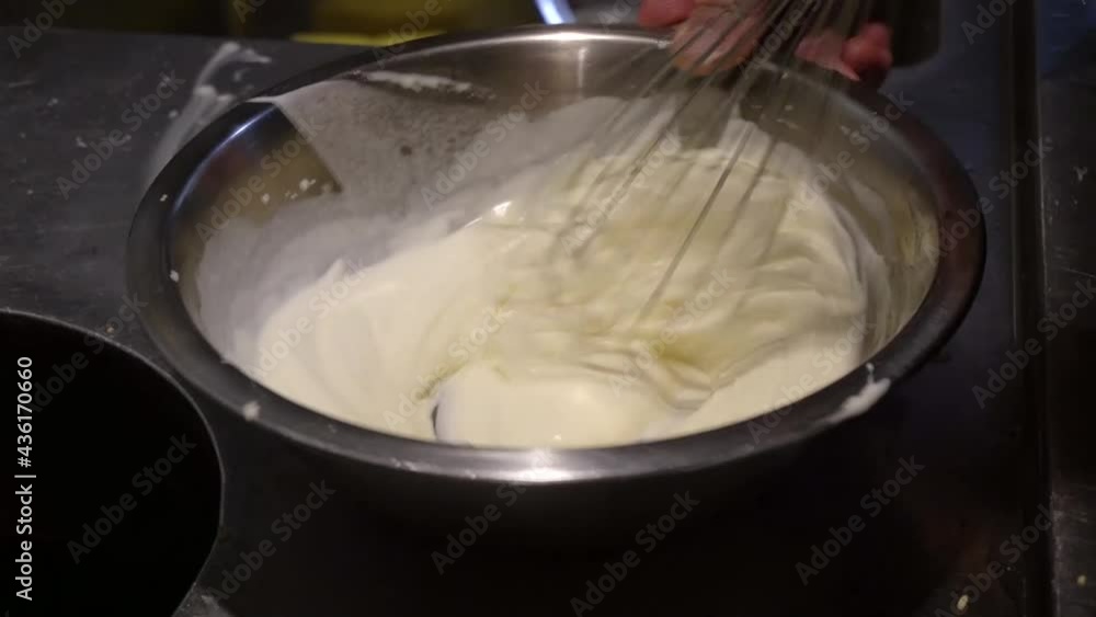 Whipped cream by hands using whisk without mixer. Whipped cream by hands using whisk without mixer.