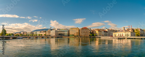 Panoramic view over Leman lake during sunset in the historical downtown of Geneva, Switzerland, summer.