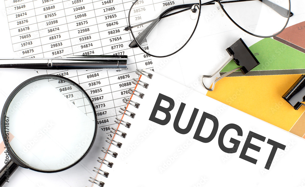 BUDGET - the inscription of text on the Notepad, and chart. Business concept BUDGET - the inscription of text on the Notepad, and chart. Business concept