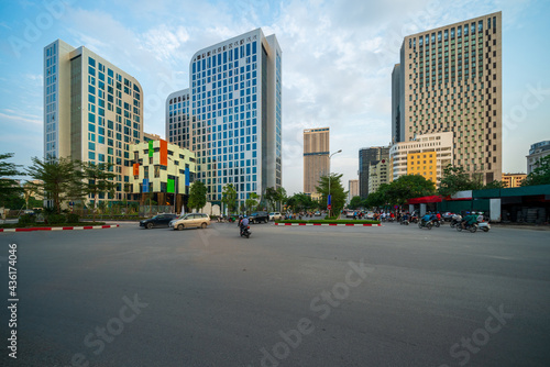 Cityscape of a street in Hanoi with high buildings
