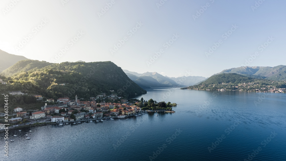 Pella village panoramic view on Lake Orta, Piedmont. Shot at sunset from a drone.