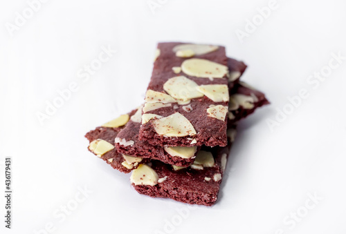 crispy brownies cracker snack with almond nut on white