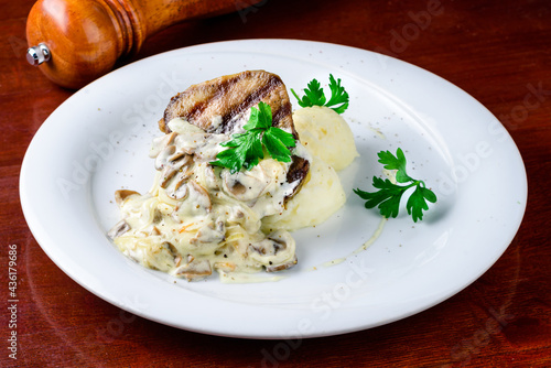 Comfort home cooked food - grilled pork, mashed potatoes with creamy mushroom sauce