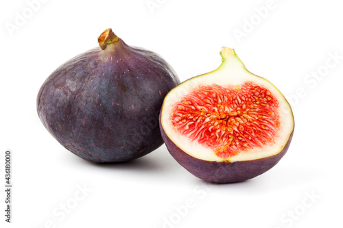 Whole and half fig isolated on white background