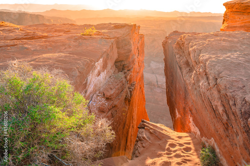 Cleft in the red rocks in Arizona  amazing sunset view