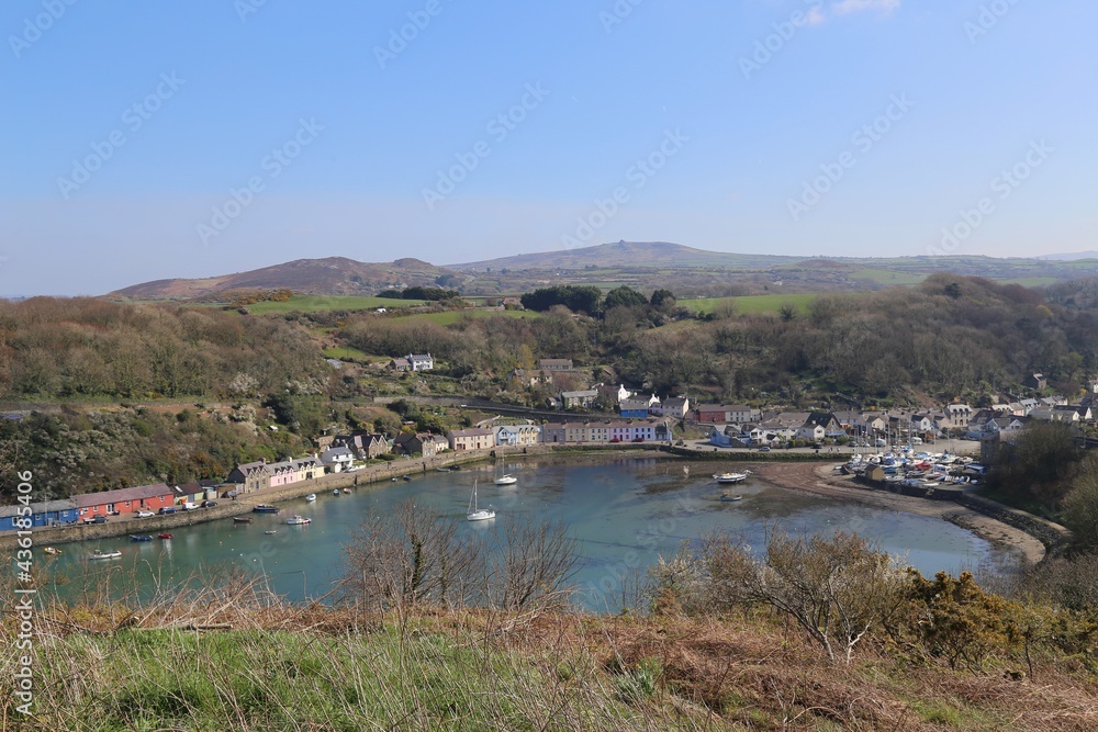 A sunny view over the harbour and cottages in Lower Fishguard, Pembrokeshire, Wales, UK.