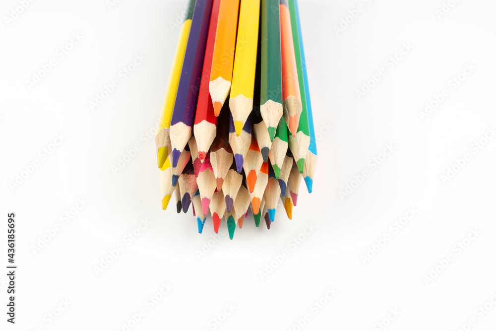 stack of wooden colored crayons on white background stack of wooden colored crayons on white background