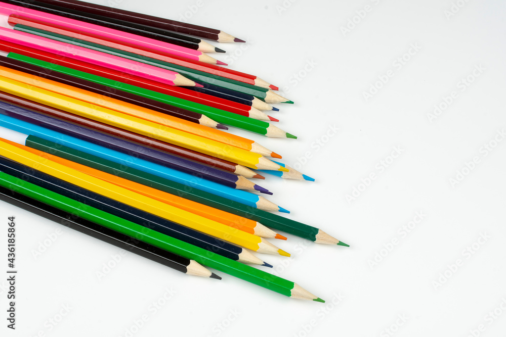 Fototapeta premium a stack of wooden colored pencils for drawing