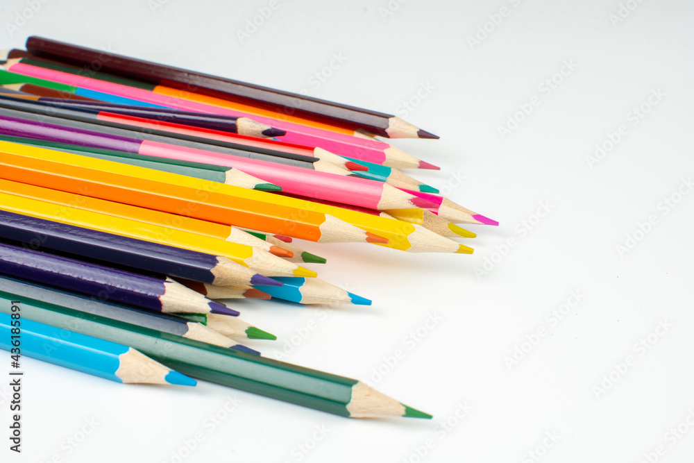a stack of wooden colored pencils for drawing