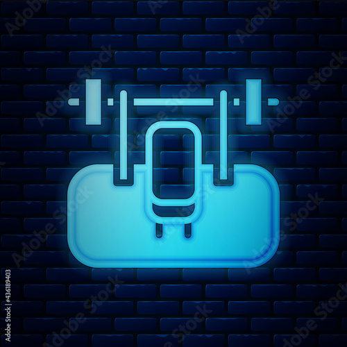 Glowing neon Bench with barbel icon isolated on brick wall background. Gym equipment. Bodybuilding, powerlifting, fitness concept. Vector
