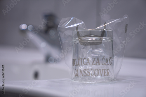 Hotel glass in the bathroom