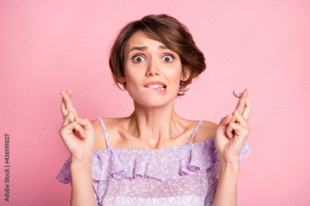 Portrait of young attractive shocked crazy frightened woman worrying about exam bite lips isolated on pink color background Portrait of young attractive shocked crazy frightened woman worrying about exam bite lips isolated on pink color background