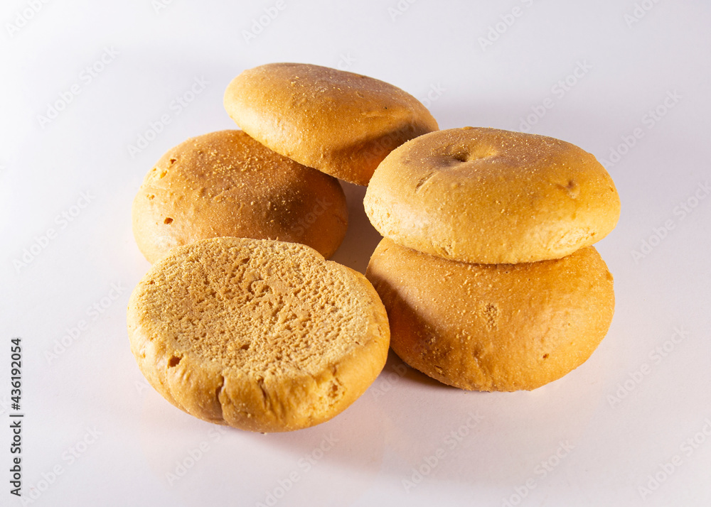 Five traditional handmade baked Bela biscuits on white Background. It is a common companion at afternoon tea to many people in Chittagong, Bangladesh. chittagonian local food served with tea.