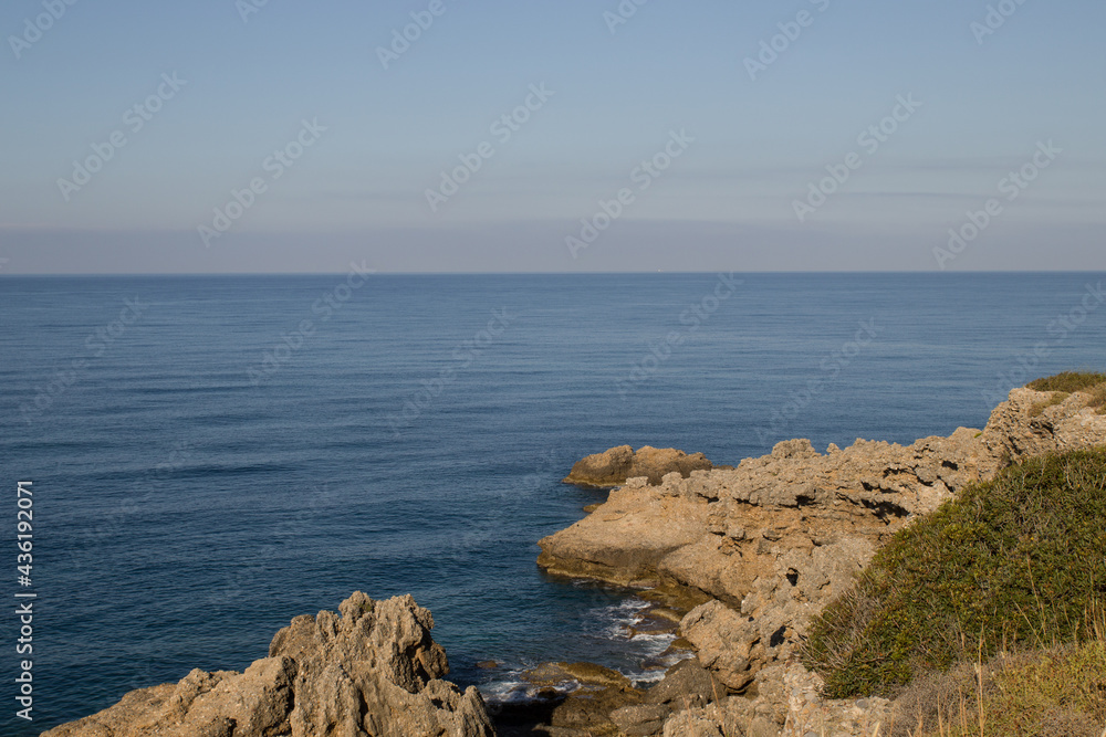 Summer sea rocky blue sky shore