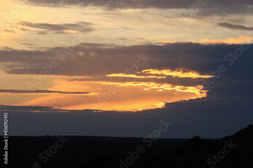 Fototapeta Naklejka Na Ścianę i Meble -  Golden Lined Clouds at Sunset of Elk Mountain