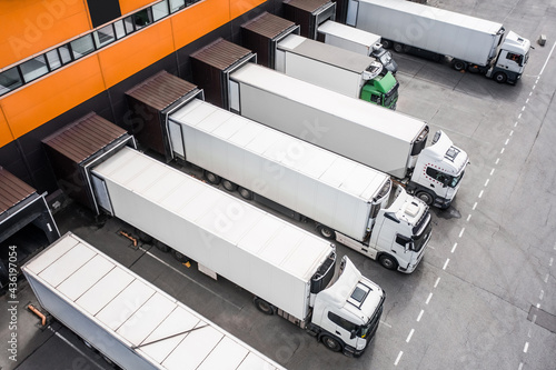 Obraz na płótnie Aerial view of trucks loading in the distribution hub