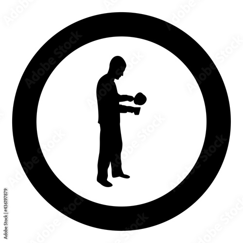 Man with saucepan in his hands preparing food Male cooking use sauciers water poured in mug silhouette in circle round black color vector illustration solid outline style image photo