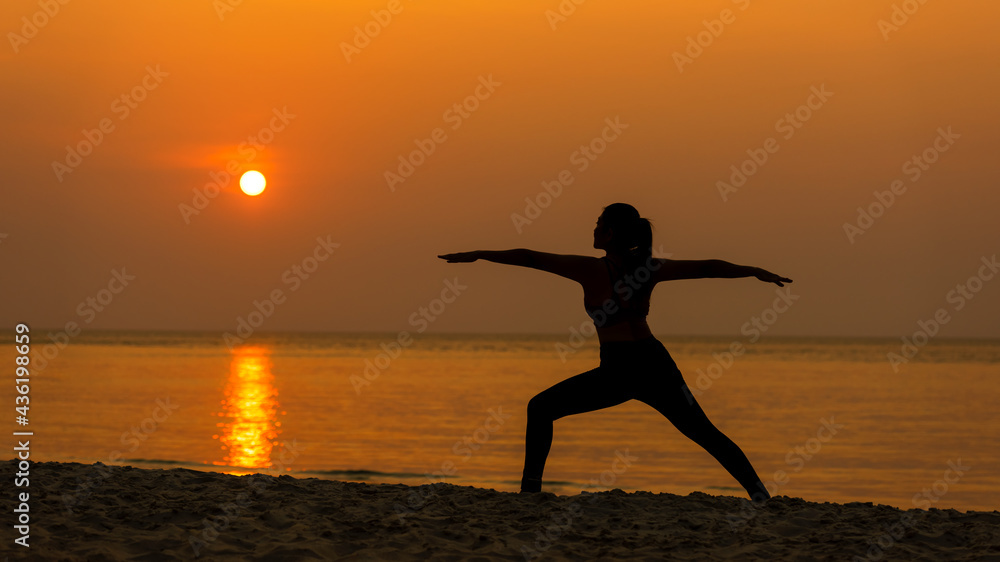 Silhouette lifestyle woman yoga exercise for healthy life.  Young girl or people pose balance body vital zen and meditation workout and fitness sport outdoor sunset near the beach. Sea background