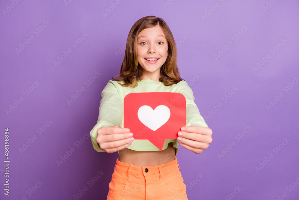 Photo of young little girl happy positive smile show like reaction icon blogger popular isolated over violet color background Photo of young little girl happy positive smile show like reaction icon blogger popular isolated over violet color background
