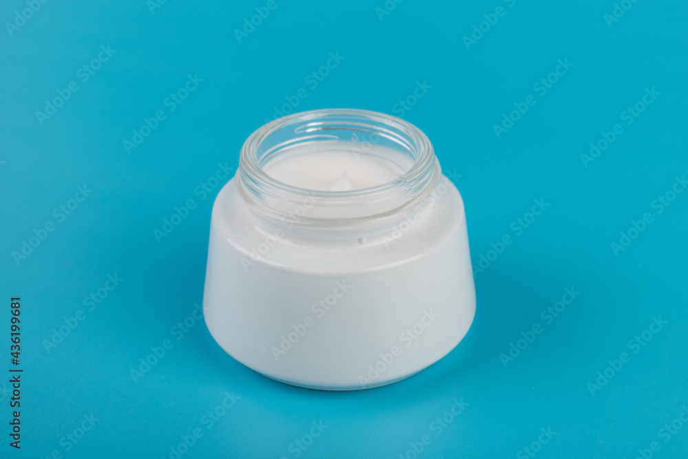 Beauty Cream Texture Close Up. Cosmetic skincare product in jar on blue background. High Quality Beauty Cream Texture Close Up. Cosmetic skincare product in jar on blue background. High Quality