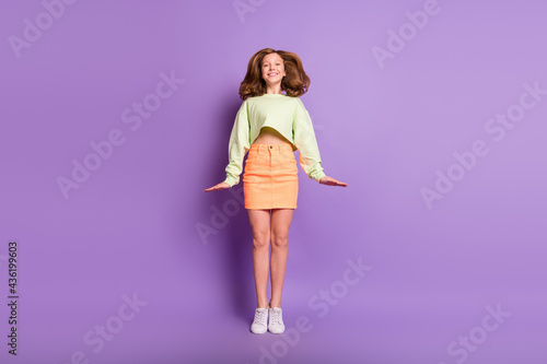 Fototapeta Naklejka Na Ścianę i Meble -  Full body photo of young excited preteen girl happy positive smile have fun isolated over violet color background