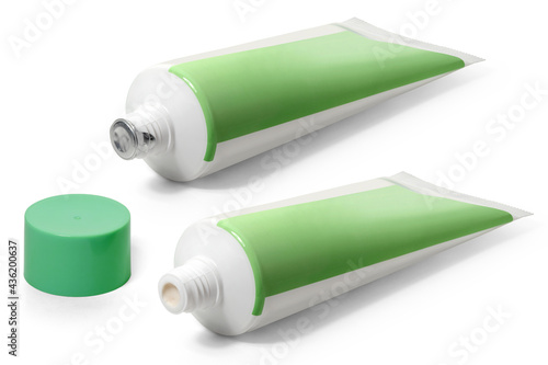 Two white with green tubes of ointment on a white background. Full depth of field. With clipping path