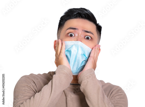 Alarming scared  man in medical mask and afraid of coronavirus infection