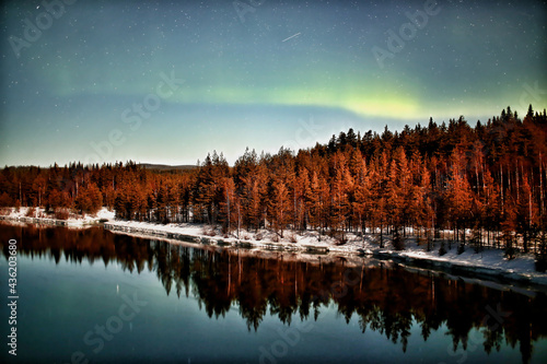 Northern lights over Skellefte River in Swedish lapland