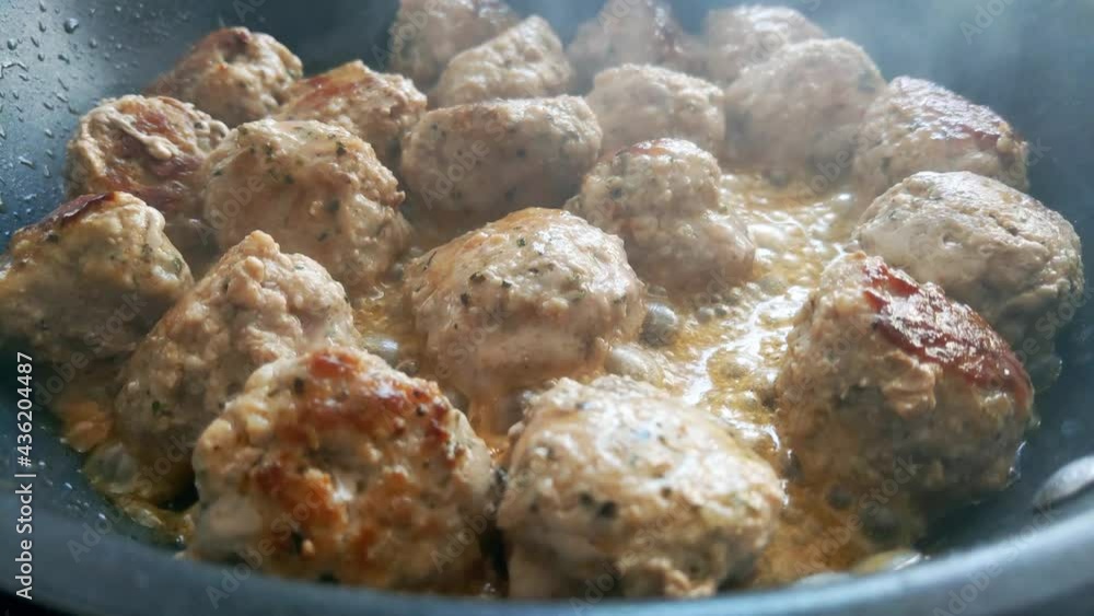 Meatballs are fried in a skillet. Delicious homemade food Meatballs are fried in a skillet. Delicious homemade food