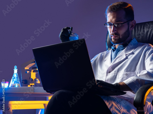 Modern scientist with a lap...
