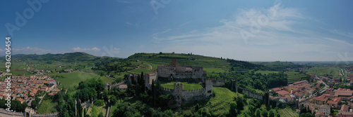 Aerial panorama of Italy castles. The famous medieval castle on the hill. Soave castle aerial view  province of Verona  Italy.