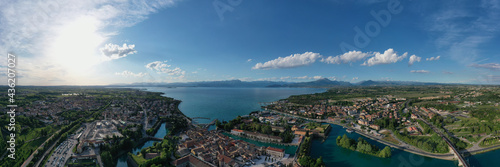 Panorama of the city of Peschiera del Garda on Lake Garda, Italy. Aerial view of a tourist town in Italy. Italian resorts on Lake Garda. The city of peschiera del garda at sunset.