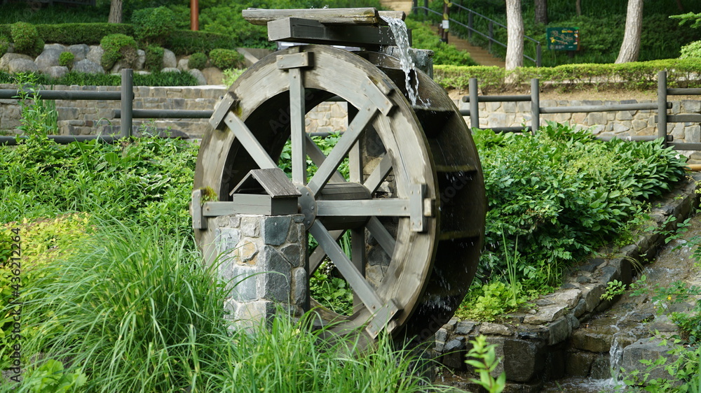 Water Wheel on the Park at Sunny Day Spring