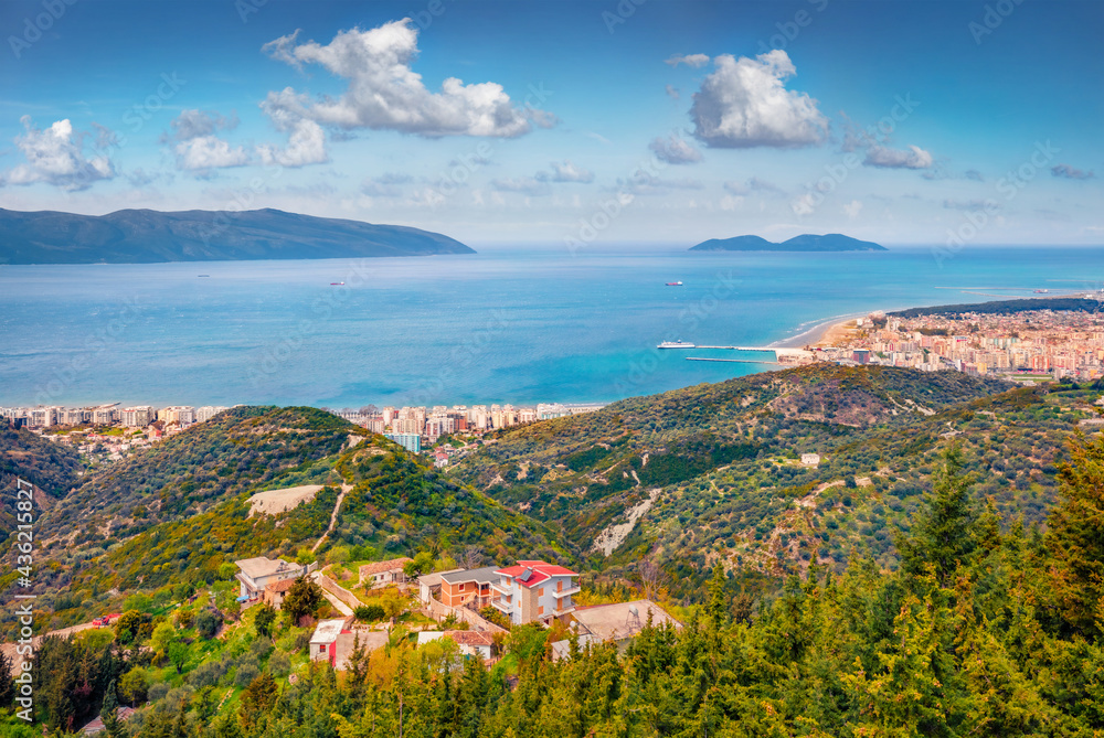 Aerial spring cityscape of Vlore city from Kanines fortress. Impressive morning sescape of Adriatic sea. Splendid outdoor scene of Albania, Europe. Traveling concept background..