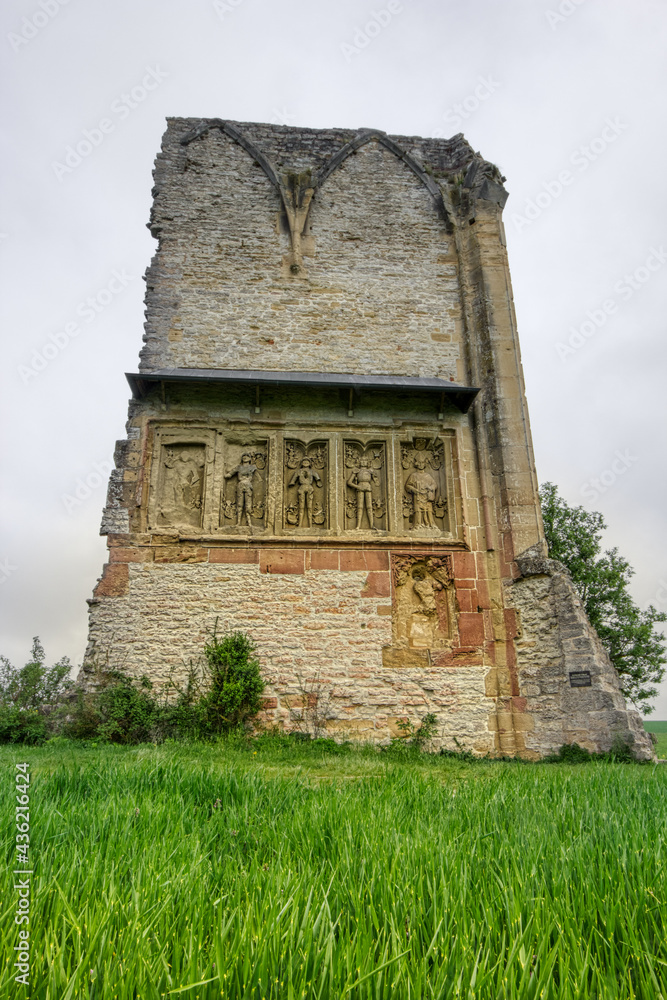 Fototapeta premium Medieval ruin monastery Wall of Anhausen, with Epitaph Statues, in Tauber Valley, Bavaria, South Germany
