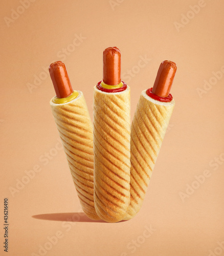 Fotografie Set of French hot dogs with different sauces - ketchup, mustard and mayonnaise