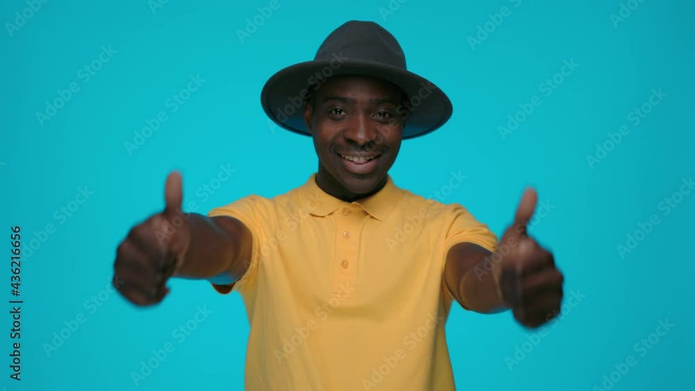 Portrait of smiling african man showing thumbs up Portrait of smiling african man showing thumbs up