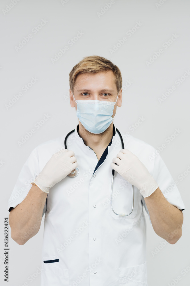 Doctor portrait wearing gloves, Medical Mask and Stethoscope. Medical Concept on white background Doctor portrait wearing gloves, Medical Mask and Stethoscope. Medical Concept on white background