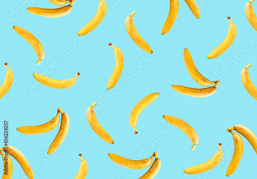 Ripe bananas on a light blue background. Bananas pattern.
