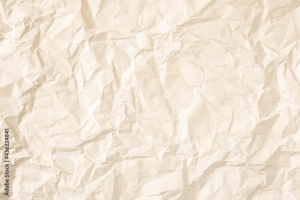 Fototapeta premium Warm crumpled paper as background.
