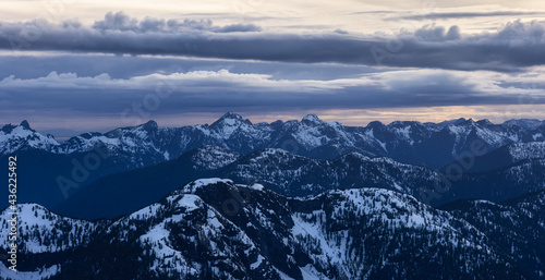 Aerial View from Airplane of Canadian Mountain Landscape in Spring time. Colorful Sunset Sky. North of Vancouver, British Columbia, Canada. Authentic Image © edb3_16