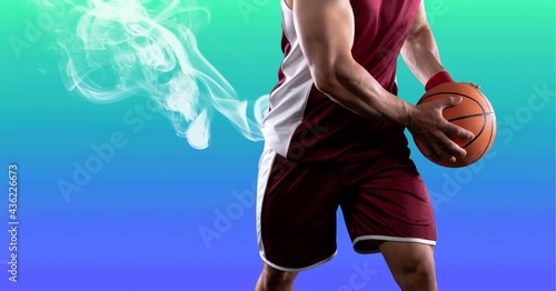 Composition of caucasian male basketball player holding ball with copy space