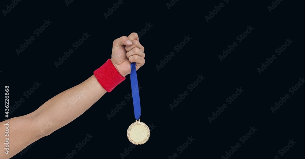 Composition of caucasian male athlete holding gold medal with copy space on black background Composition of caucasian male athlete holding gold medal with copy space on black background