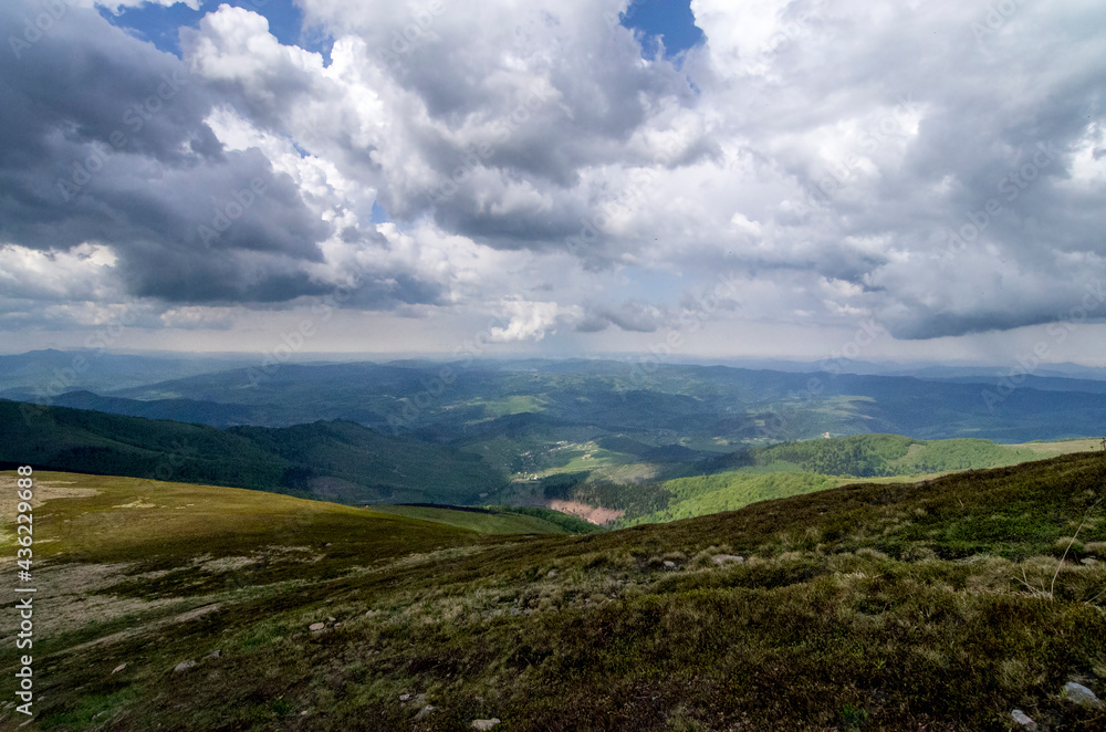 Mountain panoramic landscape with clouds and blue sky