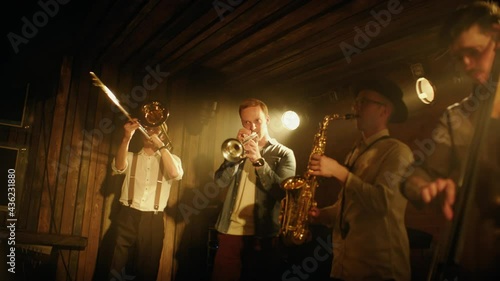 HANHDHELD CU Portrait of jazz band members playing brass instruments on stage during a live concert in small venue. Shot on ARRI Alexa Mini with 2x anamorphic lens