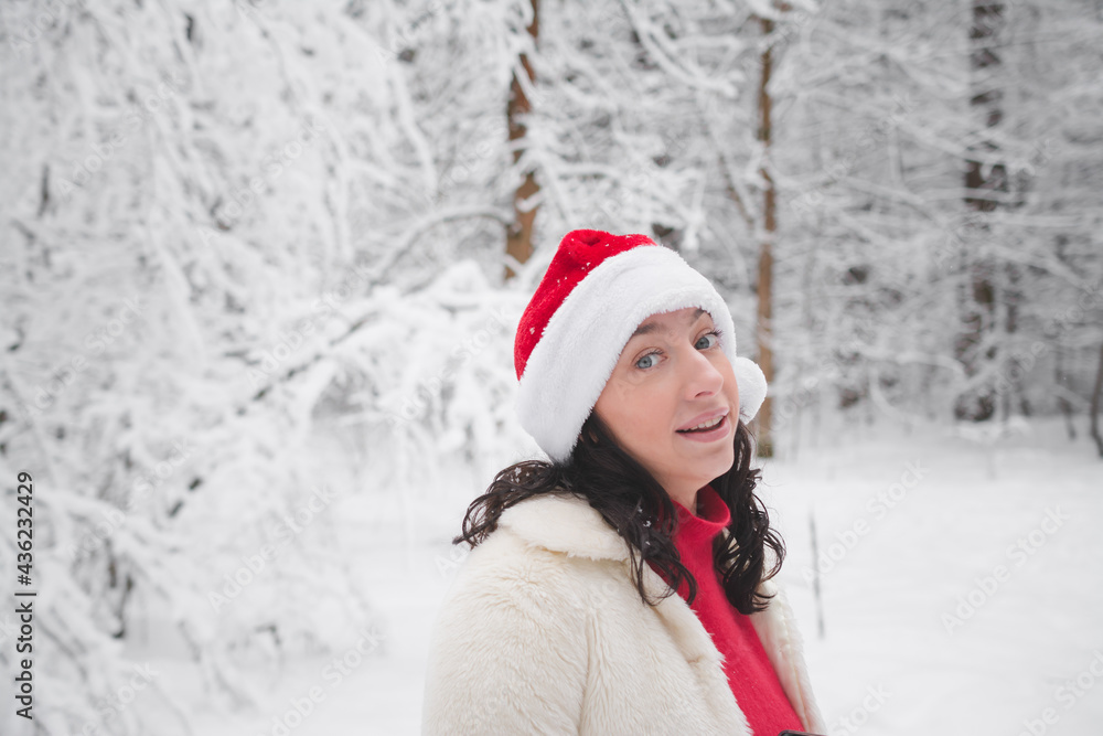 Beautiful girl in winter snowy forest in christmas clothes Beautiful girl in winter snowy forest in christmas clothes