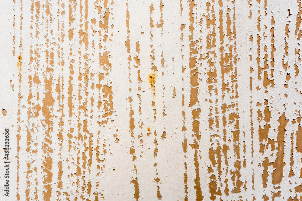 Fototapeta premium Background of rusty metal wall covered with paint peeling off