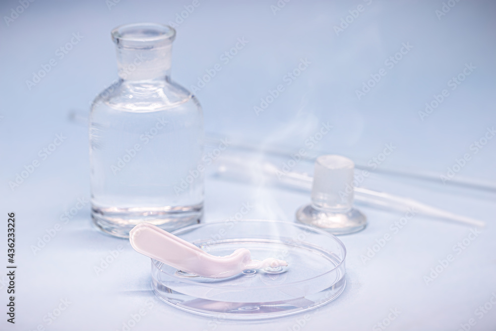 Sulfuric acid in petri dish, melting plastic spoon, corrosive acid in action Sulfuric acid in petri dish, melting plastic spoon, corrosive acid in action