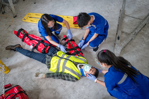 Emergency medical teams are First aid for injuries in work accidents. Using first aid equipment support to loss of feeling or loss of normal movement and Loss of function in limbs, First aid training 