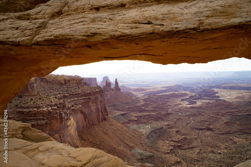 View of the canyon from Mesa Arch in Canyonlands National Park in Moab, UT